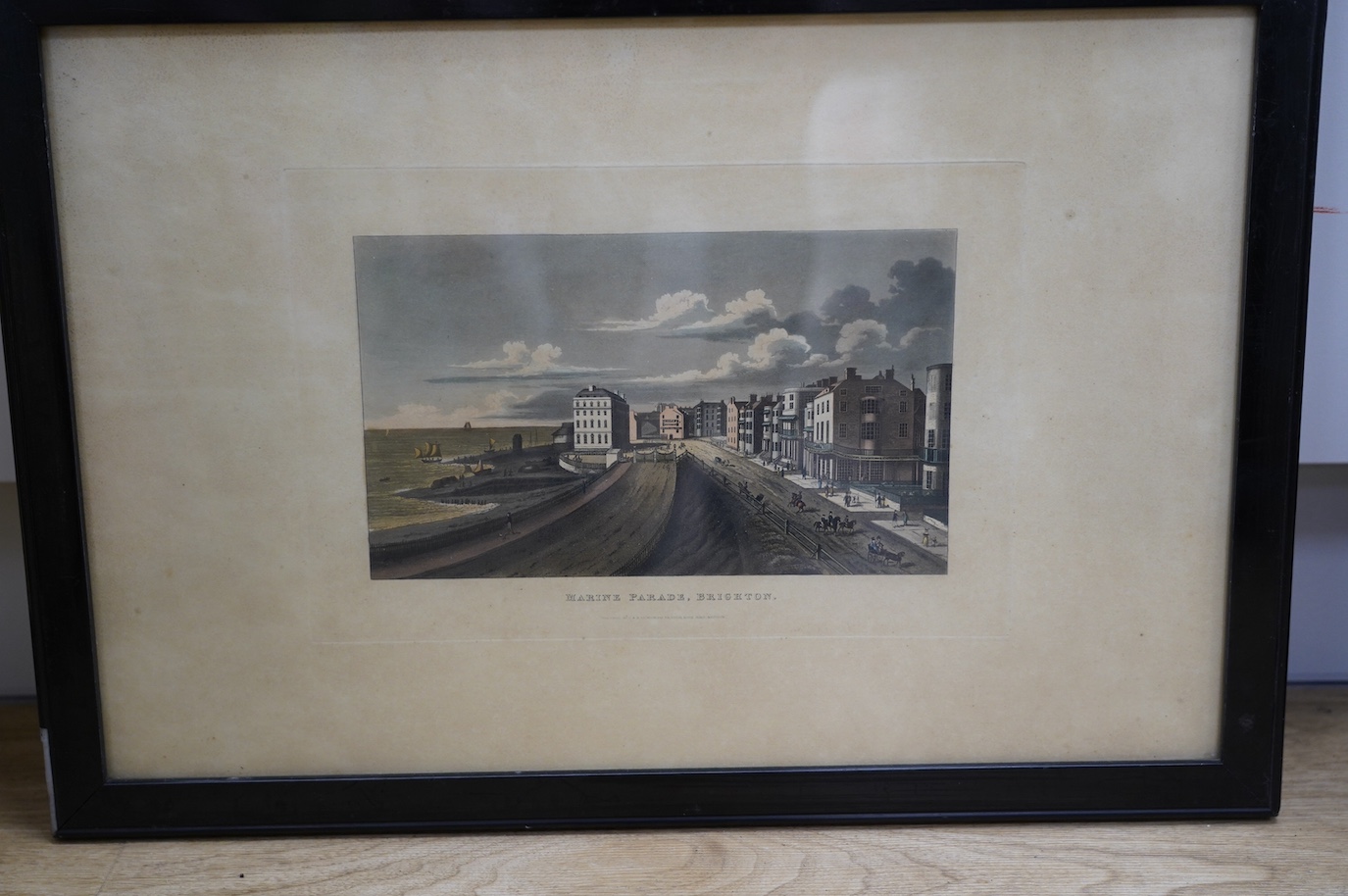 Four 19th century, hand coloured engravings, Brighton views including ‘East Cliff, Brighton, Storm Approaching’, published by C & R Sicklemore, and ‘The Battery, Brighton’, 32 x 48cm. Condition - poor